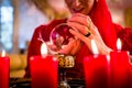 Soothsayer in Seance with Crystal ball and smoke Royalty Free Stock Photo