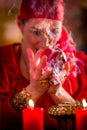 Soothsayer in Seance with Crystal ball and smoke Royalty Free Stock Photo