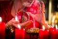 Soothsayer in Seance with Crystal ball and smoke Royalty Free Stock Photo