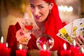 Soothsayer in Seance or session with tarot cards Royalty Free Stock Photo