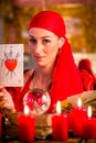 Soothsayer in Seance or session with tarot cards Royalty Free Stock Photo