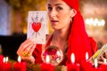 Soothsayer in Seance or session with tarot cards Royalty Free Stock Photo