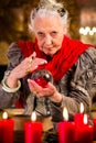 Soothsayer during session with crystal ball Royalty Free Stock Photo