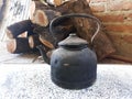 sooty kettle from the smoke from the wood fire Royalty Free Stock Photo