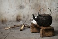 Sooty old teapot and white enamel mug Royalty Free Stock Photo