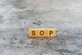 SOP Standard Operating Procedure text on wooden block Royalty Free Stock Photo