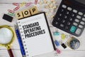 SOP - Standard Operating Procedures acronym on notepad, business and financial concept background Royalty Free Stock Photo