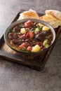 Sopa da Pedra Portuguese Stone Soup closeup in the plate. Vertical