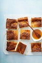 Sopapilla cheesecake bars with cinnamon drizzled with honey