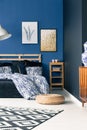 Sophisticated bedroom with blue walls Royalty Free Stock Photo