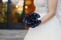 Sophisticated dark plum calla lilies bridal bouquet, the perfect accessory for a regal and mysterious effect