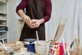 Sophisticated dedicated man in apron making Royalty Free Stock Photo
