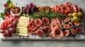 sophisticated marble charcuterie board with brie, salami roses, nuts, grapes, and figs creates a gourmet dining Royalty Free Stock Photo