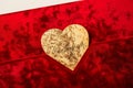 A sophisticated red Valentine\'s Day card, featuring a velvet texture and a gold foil heart in the center