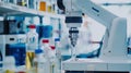 a sophisticated robot seamlessly assists scientists in conducting experiments, using precise measurements and expertly