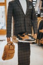 Sophisticated suit with derby shoes and a bag on the mannequin on the display Royalty Free Stock Photo