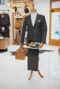 Sophisticated suit with derby shoes and a bag on the mannequin on the display Royalty Free Stock Photo