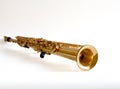 Soprano Sax, wind instrument saxophone lying on a white background, copy space Royalty Free Stock Photo