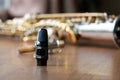 Soprano Saxophone Mouthpiece, Closeup Woodwind Instrumental Equipment on Blur Saxophone Background.