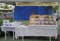 Woman sells soap in suration of street festival