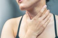 Sore throat pain women. Woman hand touching neck with sore throat feeling bad. Healthcare and medicine concept