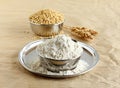 Sorghum Flour in a Steel Bowl on a Plate Royalty Free Stock Photo