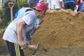 Villagers work together to repair damaged village footpaths.