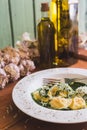 Sorrentino with parmesan cheese, garlic and olive oil on a wooden table