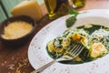 Sorrentino with parmesan cheese and olive oil on a wooden table