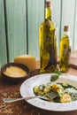 Sorrentino with parmesan cheese and olive oil on a wooden table