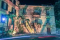 Sorrento cityscape by night with street lamp and blurred car lights, Italy