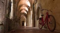 Red bicycle in the cloisters next to the Church of San Francesco / Chiostro di San Francesco in Sorrento on the Amalfi Coast. Royalty Free Stock Photo