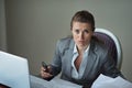 Sorrowful business woman working at desk Royalty Free Stock Photo