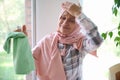 Sorrowful housewife, Arab Muslim woman in hijab, holds her head from fatigue, closes her eyes from frustration and many household