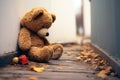 Sorrowful scene Teddy bear sits against house wall, childs loneliness