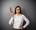 Sorrowful woman holding mask Royalty Free Stock Photo