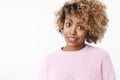 Sorry but. African-american woman feeling awkward as hinting friend at flaw, making apologizing smile raising eyebrows