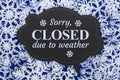 Sorry Closed due to weather chalkboard sign on snowflakes Royalty Free Stock Photo