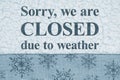 Closed due to weather sign on blue snowflake border on sherpa material Royalty Free Stock Photo