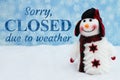 Sorry closed due to weather with a snowman with snowflakes