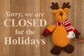 Sorry we are closed for the holidays sign with a winter moose Royalty Free Stock Photo