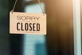 SORRY WE ARE CLOSED PLEASE COME BACK AGAIN notice sign wood board label hanging through glass door Royalty Free Stock Photo