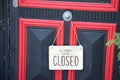 Sorry we are closed sign board wooden panel hanging on door of cafe Royalty Free Stock Photo