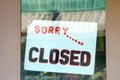 Sorry we are closed sign in glass window Royalty Free Stock Photo