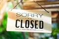 Sorry we are closed sign hang on door of business. Royalty Free Stock Photo