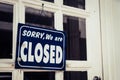 Sorry we are closed sign hang on door of business shop Royalty Free Stock Photo