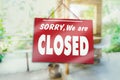 Sorry we are closed sign hang on door of business shop Royalty Free Stock Photo