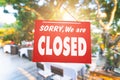 Sorry we are closed sign hang on door of business shop Royalty Free Stock Photo