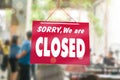 Sorry we are closed sign hang on door of business shop Royalty Free Stock Photo