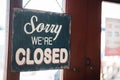 Sorry we are closed sign hang on door of business shop Royalty Free Stock Photo